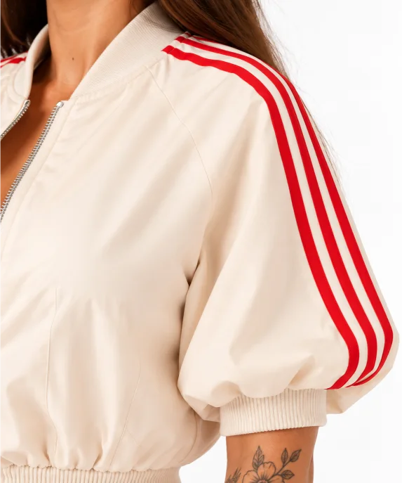 LUMINA cream cropped jacket with red sleeve stripes – detail view